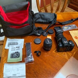 Canon Rebel XS ESO Camera with Lenses, bag, charger etc + a bonus small tripod.